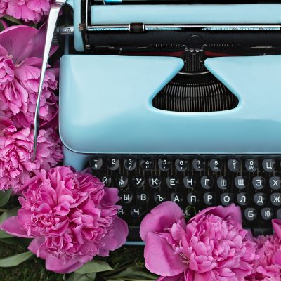 typewriter and flowers - Romance Story Ideas and Writing Prompts Bryn Donovan