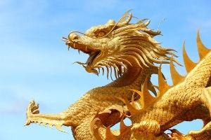 a golden statue of a Chinese dragon