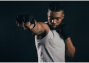 Photo of a professional boxer with one fist extended.