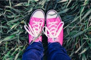 50 young adult novel writing prompts | pink converse sneakers in the grass