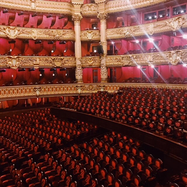 empty theater full of velvet-covered seats #Notre Dame Before The Fire 