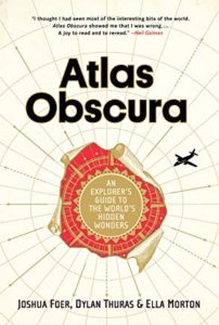 Atlas Obscura book cover featuring a compass and an airplace