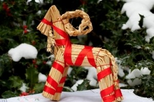 Yule Goat made out of straw, tied with red ribbons