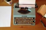 typewriter, coffee cup, blank paper