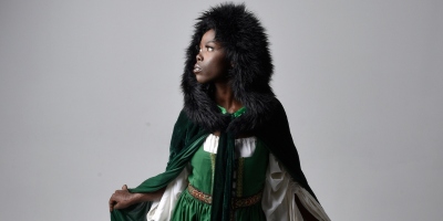 Black woman in cloak with fur hood - medieval names for women