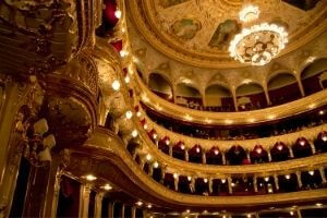 interior of lavish opera house with rows of seats