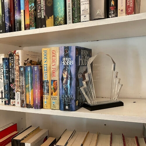 glass trophy on a bookcase