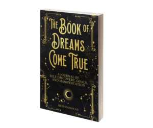 black journal with moon, stars, and title Book of Dreams Come True - a Journal of Self-Discovery, Goals, and Manifestation, by Bryn Donovan