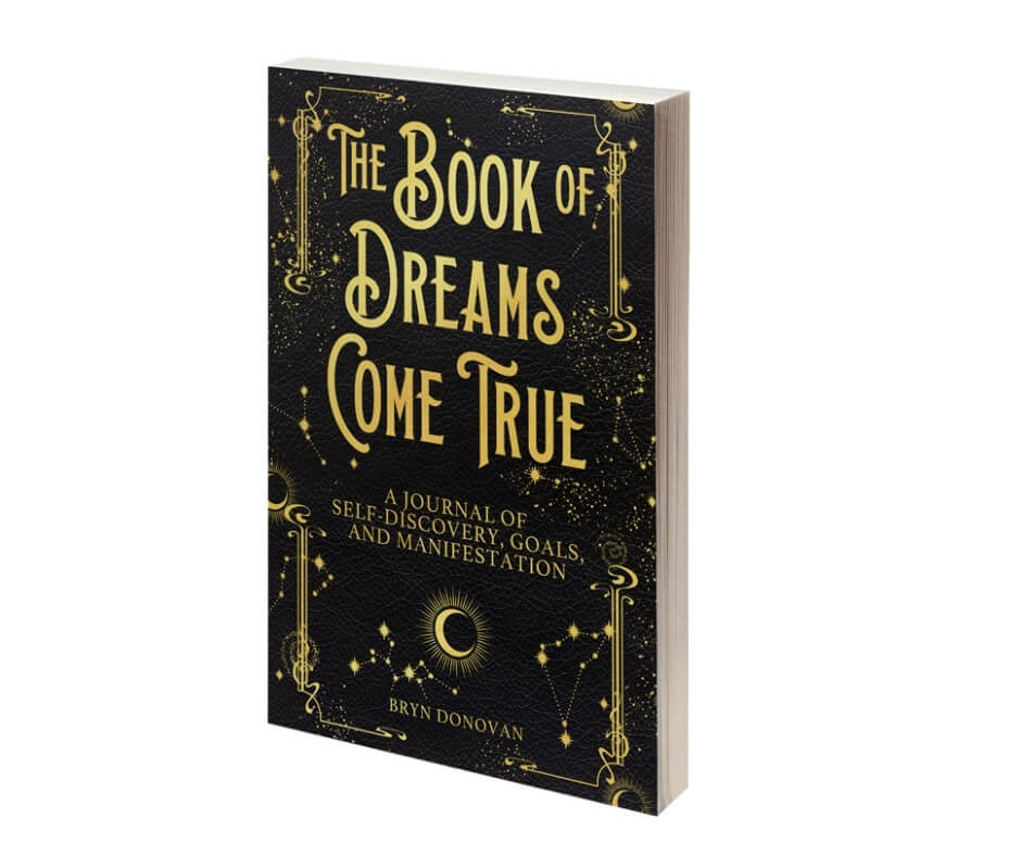 black journal with moon, stars, and title Book of Dreams Come True - a Journal of Self-Discovery, Goals, and Manifestation, by Bryn Donovan