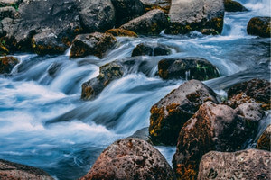 a mountain stream rushing over rocks