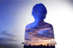 silhouette of person against sky, representing character backstory