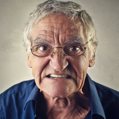 older white man with angry expression of rage