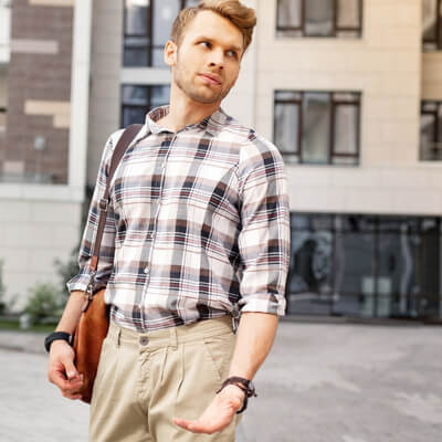 young white man on street with annoyed expression