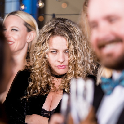 young white woman with angry expression at wedding reception