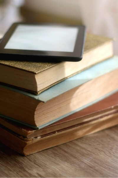 ereader on a stack of books