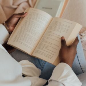 closeup of woman's hands reading a book