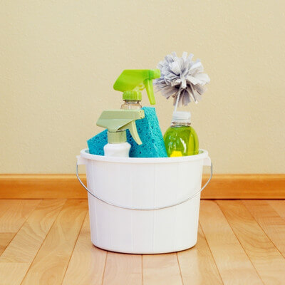 cleaning supplies in a bucket