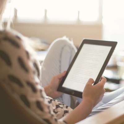 woman holding a tablet