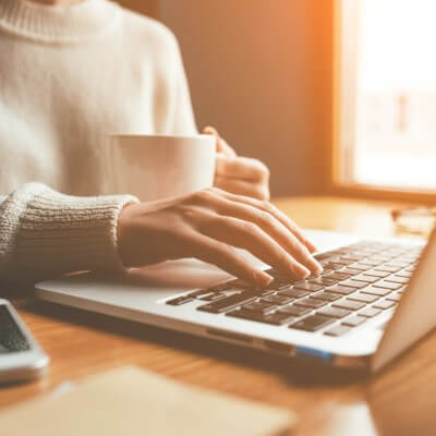 woman at laptop doing back to front editing