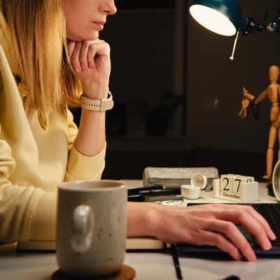 woman working at computer late at night