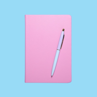 pink journal and pen