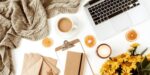 laptop, sweater, orange slices, journal