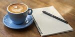 all writing prompts - cappuccino, pen, blank notebook