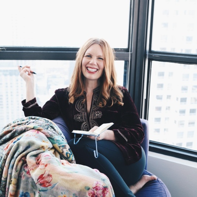 BRYN DONOVAN AUTHOR SMILING holding journal and pen