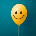 balloon with smiley face - link to list of 100 ways to describe happiness