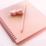 notebook with heart erasers - link to romance plot idea list