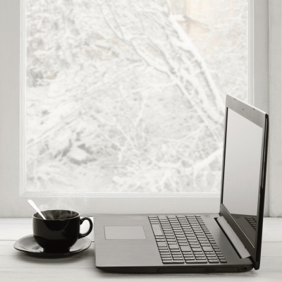 coffee, laptop, snow outside window