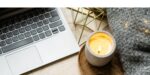 laptop keyboard, candle, blanket